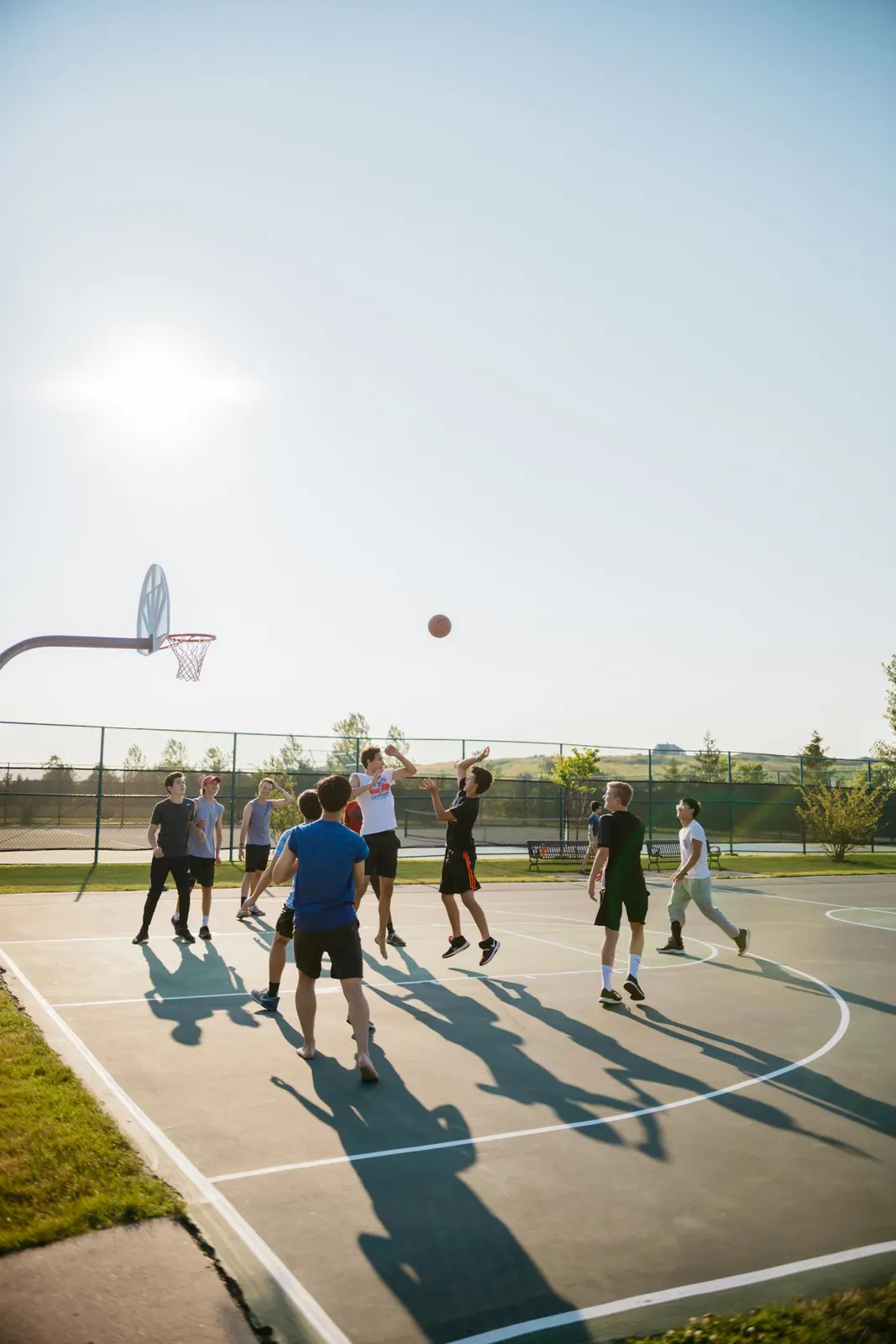 A pickup basketball game outdoors